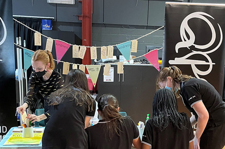 Students participating in the QPAC Kindess Tree stall