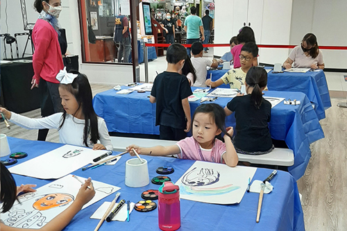Children paint their self-portraits